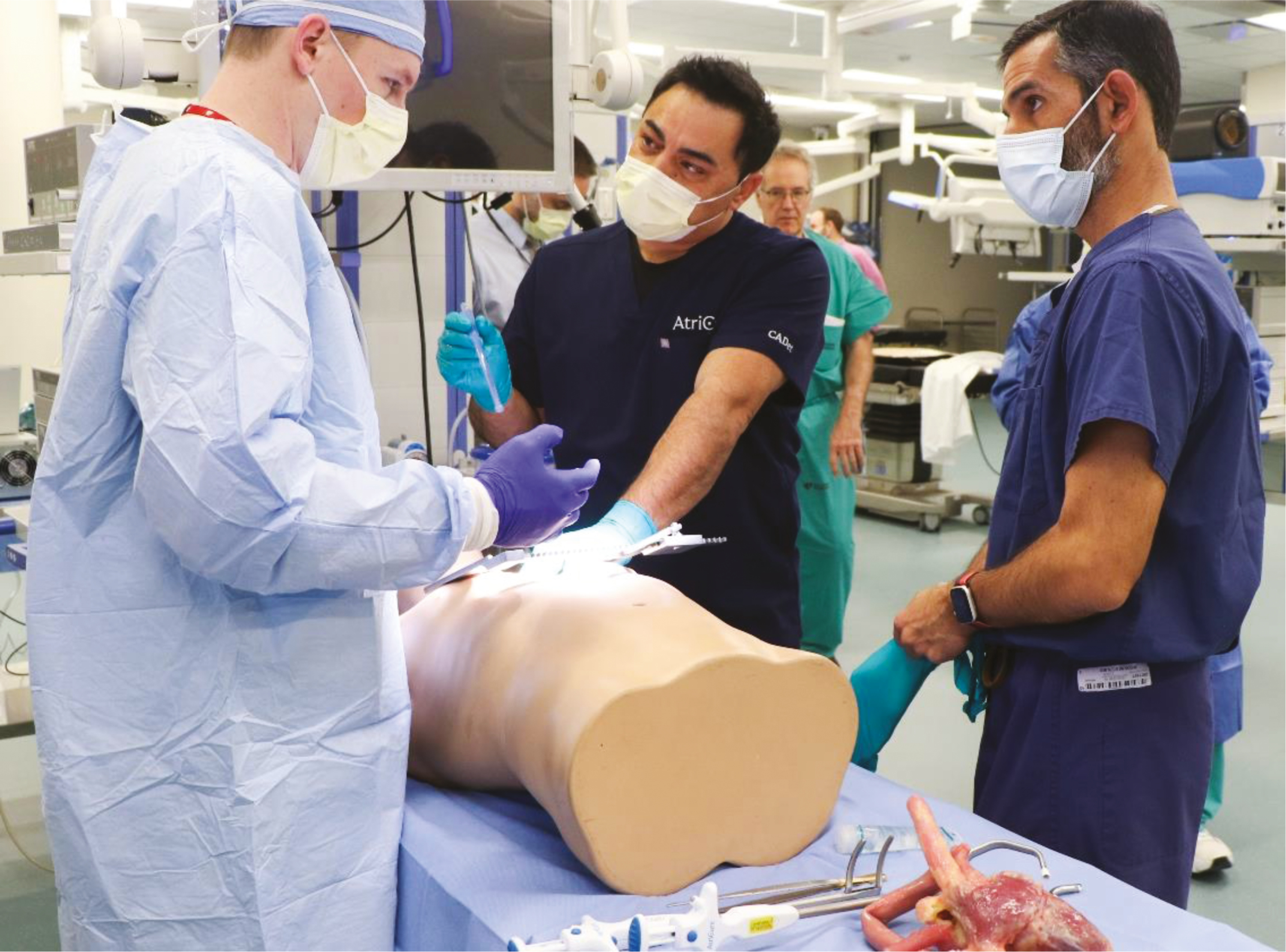 Physicians practicing advanced surgical skills in a simulated operating room