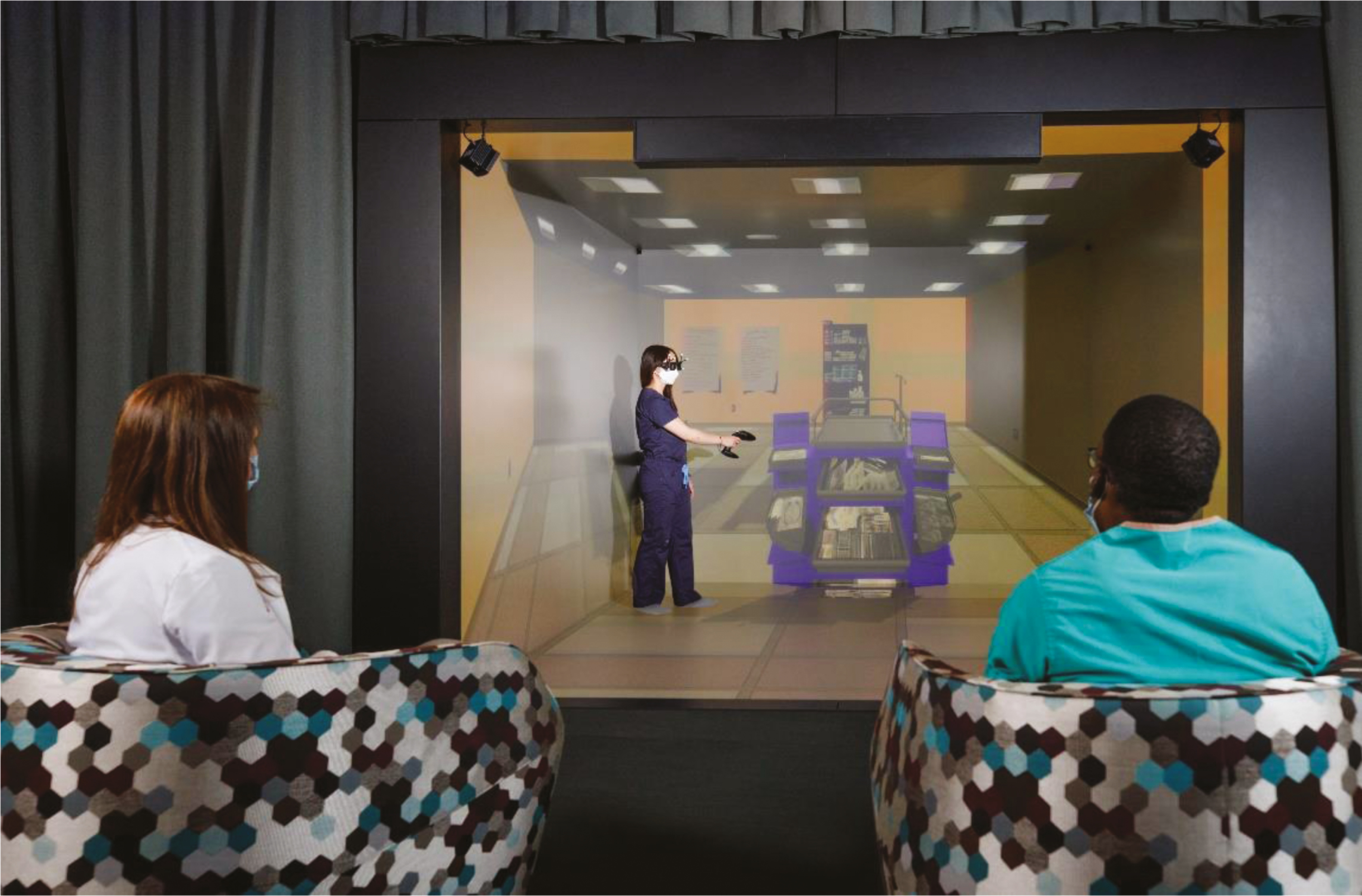 A nursing student exploring a crash cart in a virtual reality immersive 3D CAVE